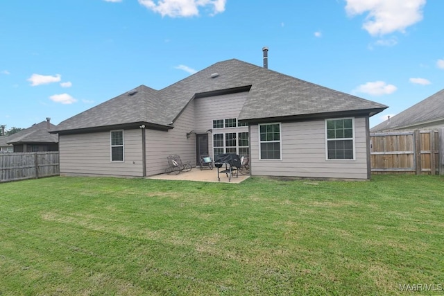 905 Overture Dr, Montgomery, AL 36117 - rear view of house with a fenced backyard, a patio area, and roof with shingles