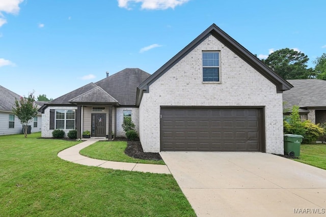 905 Overture Dr, Montgomery, AL 36117 - view of front facade featuring brick siding, a front lawn, and driveway