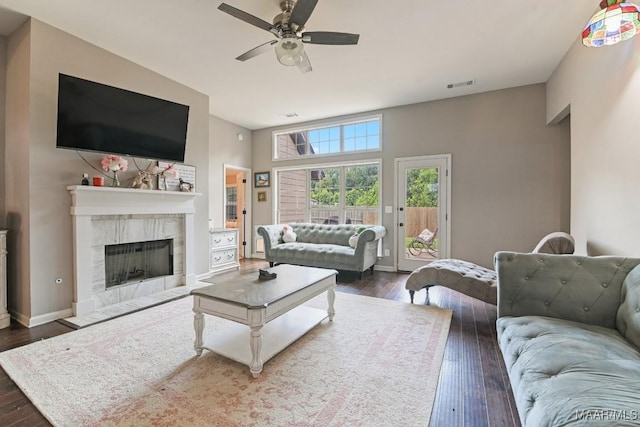 905 Overture Dr, Montgomery, AL 36117 - living room with dark wood-type flooring, a ceiling fan, and a tiled fireplace