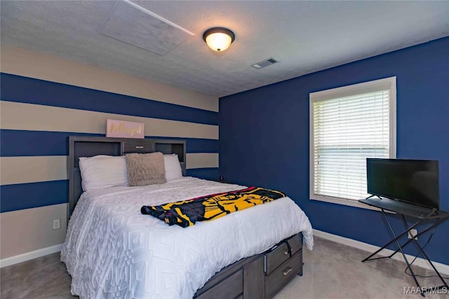 6209 Sycamore Dr, Montgomery, AL 36117 - carpeted bedroom featuring baseboards and a textured ceiling