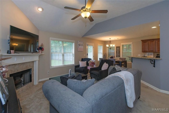 6209 Sycamore Dr, Montgomery, AL 36117 - living area featuring a chandelier, light carpet, lofted ceiling, a ceiling fan, and a tiled fireplace