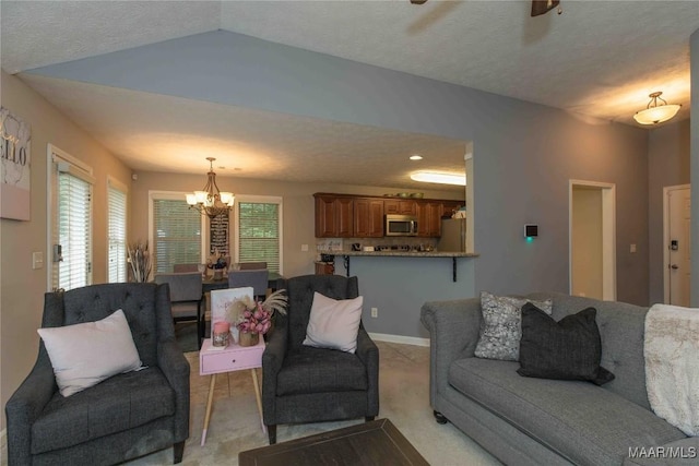 6209 Sycamore Dr, Montgomery, AL 36117 - living area with a chandelier, light colored carpet, a ceiling fan, and a textured ceiling