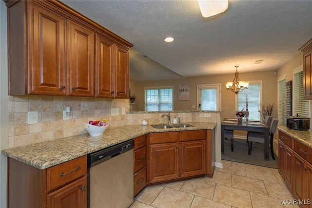 6209 Sycamore Dr, Montgomery, AL 36117 - kitchen featuring dishwasher, a peninsula, brown cabinets, a chandelier, and recessed lighting