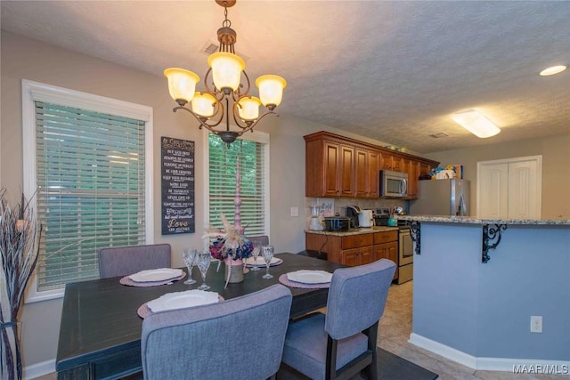 6209 Sycamore Dr, Montgomery, AL 36117 - dining room with a chandelier and baseboards