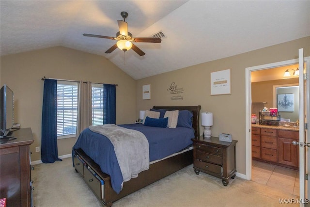 6209 Sycamore Dr, Montgomery, AL 36117 - bedroom featuring light carpet, vaulted ceiling, ceiling fan, and ensuite bath