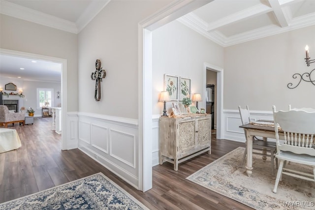 235 Midland Dr, Wetumpka, AL 36093 - dining space featuring dark wood-type flooring, ornamental molding, a wainscoted wall, a fireplace, and beam ceiling
