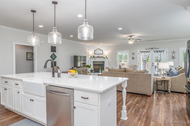 235 Midland Dr, Wetumpka, AL 36093 - kitchen featuring dishwasher, open floor plan, a fireplace, wood finished floors, and recessed lighting