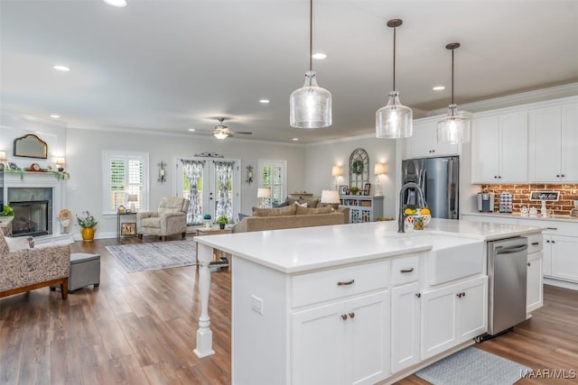 235 Midland Dr, Wetumpka, AL 36093 - kitchen with appliances with stainless steel finishes, open floor plan, recessed lighting, light countertops, and a center island with sink