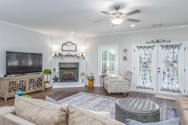 235 Midland Dr, Wetumpka, AL 36093 - living room featuring french doors, wood finished floors, a fireplace, ceiling fan, and crown molding