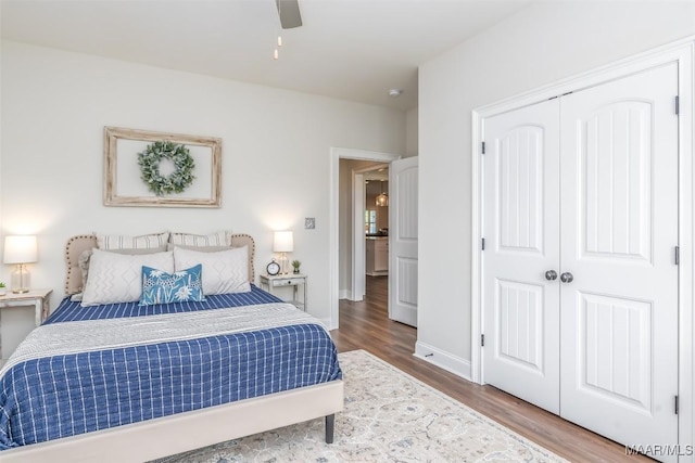 235 Midland Dr, Wetumpka, AL 36093 - bedroom with wood finished floors, a closet, and ceiling fan