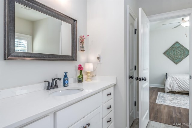 235 Midland Dr, Wetumpka, AL 36093 - bathroom featuring vanity, ceiling fan, ensuite bathroom, and wood finished floors