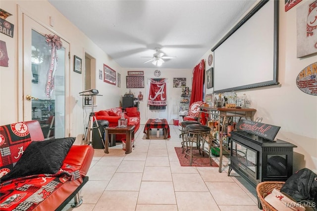 1825 W Astrid Pl, Montgomery, AL 36117 - living area featuring ceiling fan, light tile patterned floors, and a wood stove