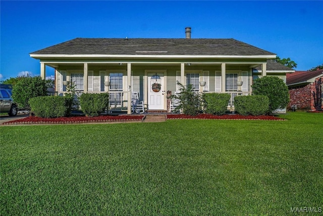 1825 W Astrid Pl, Montgomery, AL 36117 - bungalow with covered porch, a front lawn, and a shingled roof