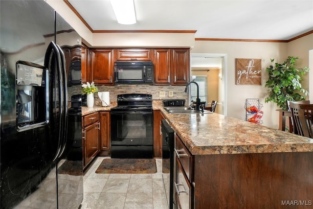 1825 W Astrid Pl, Montgomery, AL 36117 - kitchen featuring black appliances, a peninsula, backsplash, and crown molding