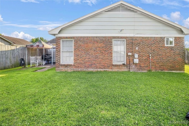 1825 W Astrid Pl, Montgomery, AL 36117 - rear view of property featuring brick siding and a gazebo