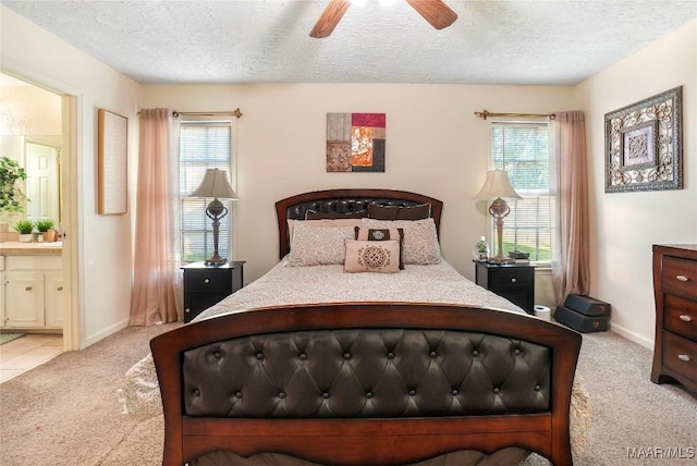1825 W Astrid Pl, Montgomery, AL 36117 - bedroom featuring carpet floors, a textured ceiling, ensuite bath, and ceiling fan