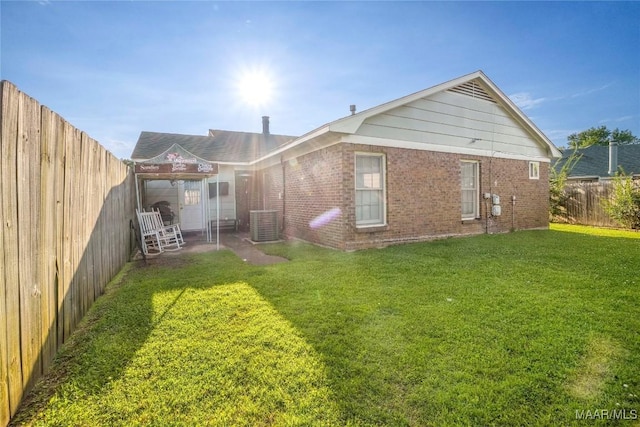 1825 W Astrid Pl, Montgomery, AL 36117 - rear view of house with a fenced backyard and brick siding