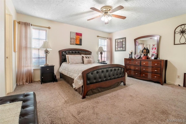 1825 W Astrid Pl, Montgomery, AL 36117 - carpeted bedroom with a textured ceiling and a ceiling fan