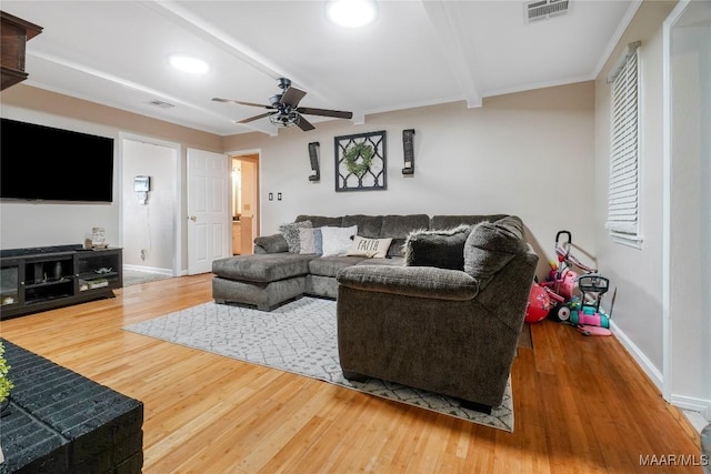 1825 W Astrid Pl, Montgomery, AL 36117 - living room with ceiling fan, wood finished floors, and beamed ceiling