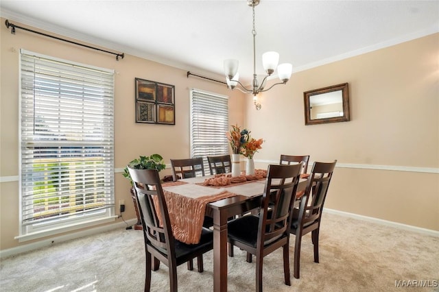 1825 W Astrid Pl, Montgomery, AL 36117 - dining space with a chandelier, light carpet, and crown molding