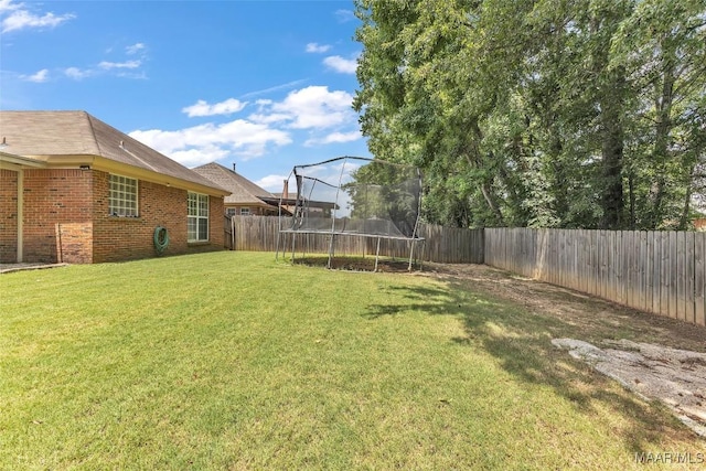 8049 Copperfield Dr, Montgomery, AL 36117 - fenced backyard with a trampoline