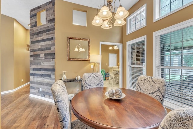 8049 Copperfield Dr, Montgomery, AL 36117 - dining room featuring a chandelier, wood finished floors, and a high ceiling