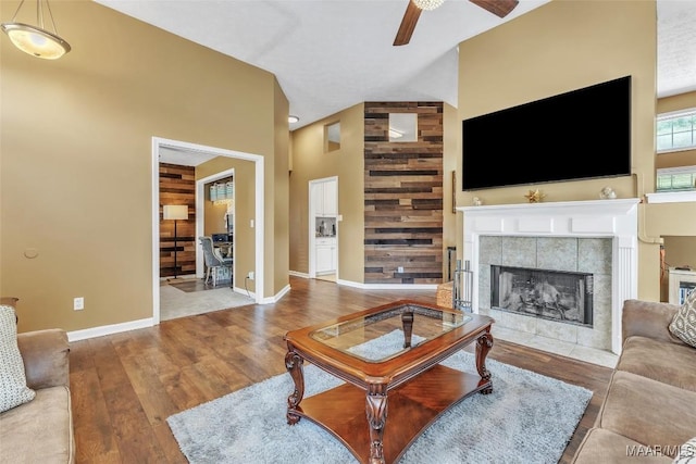 8049 Copperfield Dr, Montgomery, AL 36117 - living room with a ceiling fan, wood finished floors, a fireplace, and high vaulted ceiling
