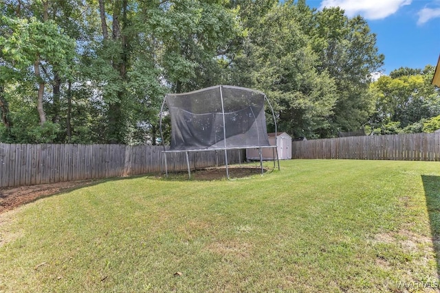 8049 Copperfield Dr, Montgomery, AL 36117 - fenced backyard with a storage unit and a trampoline