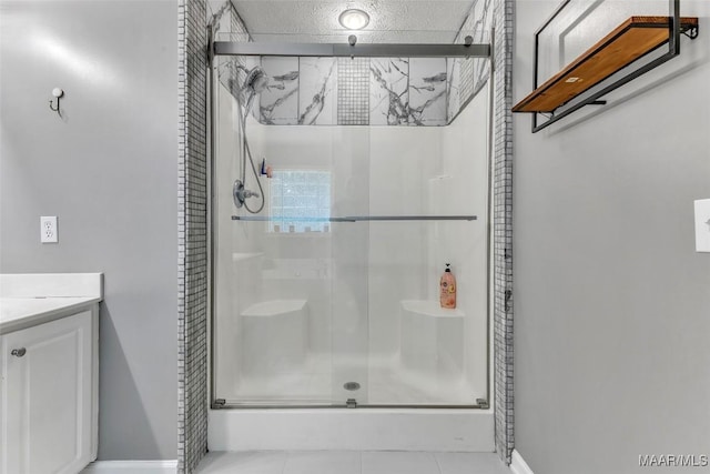 8049 Copperfield Dr, Montgomery, AL 36117 - bathroom featuring a stall shower, vanity, and tile patterned floors