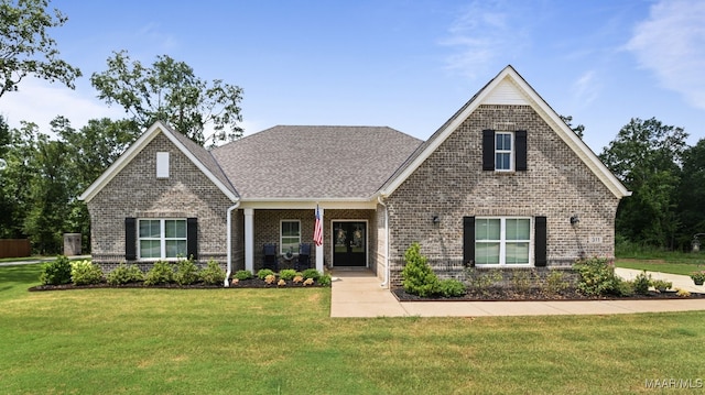 311 Alston Dr, Wetumpka, AL 36093 - view of front of home featuring brick siding, a front yard, and roof with shingles