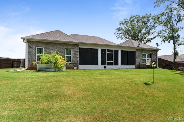 311 Alston Dr, Wetumpka, AL 36093 - rear view of house with brick siding, a sunroom, and a shingled roof