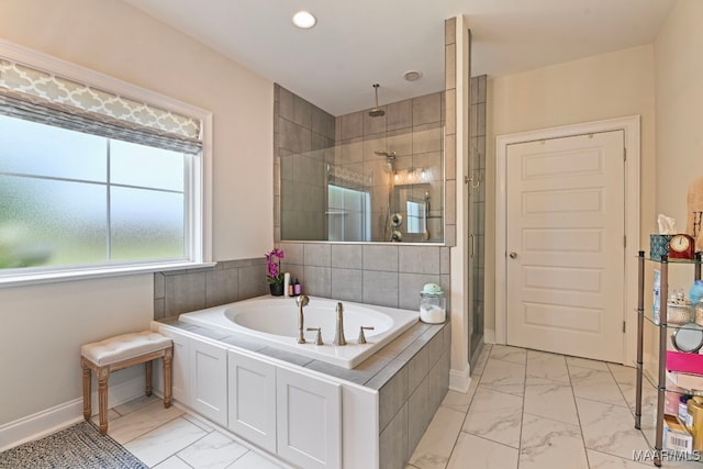 311 Alston Dr, Wetumpka, AL 36093 - bathroom with marble look tile flooring, a stall shower, a bath, and recessed lighting