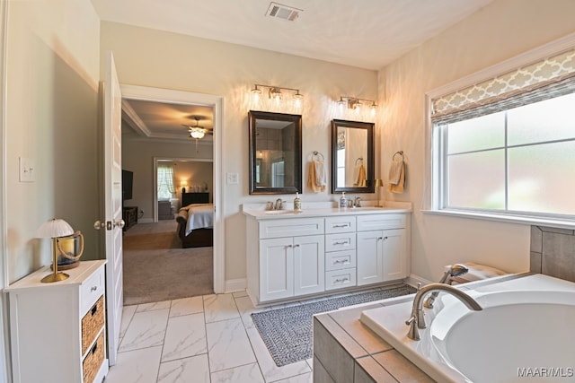 311 Alston Dr, Wetumpka, AL 36093 - ensuite bathroom with double vanity, a bath, marble look tile flooring, and a ceiling fan