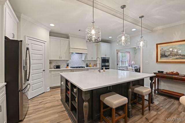 311 Alston Dr, Wetumpka, AL 36093 - kitchen featuring appliances with stainless steel finishes, light wood-style flooring, recessed lighting, white cabinets, and light countertops