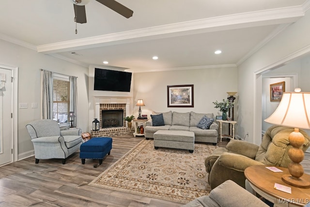 311 Alston Dr, Wetumpka, AL 36093 - living room with wood finished floors, a ceiling fan, a brick fireplace, ornamental molding, and recessed lighting