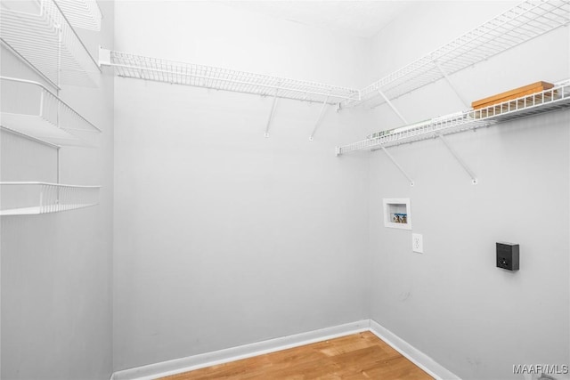 215 Hunters Rd, Eclectic, AL 36024 - laundry room with washer hookup and light wood-type flooring