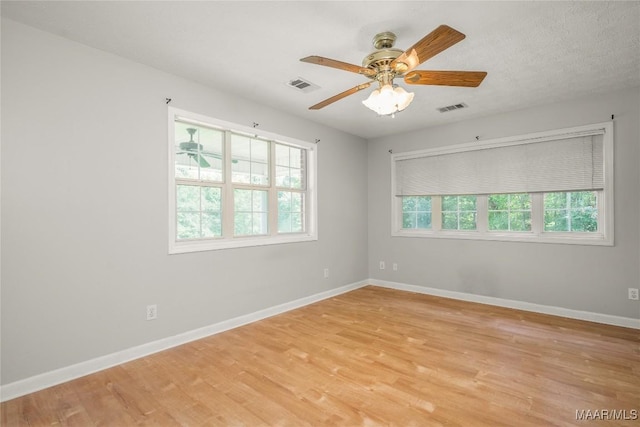 215 Hunters Rd, Eclectic, AL 36024 - empty room featuring light wood-style floors and a ceiling fan