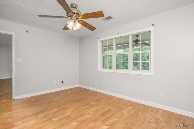 215 Hunters Rd, Eclectic, AL 36024 - spare room with light wood-type flooring, a ceiling fan, and a textured ceiling