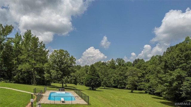 215 Hunters Rd, Eclectic, AL 36024 - view of swimming pool featuring a wooded view