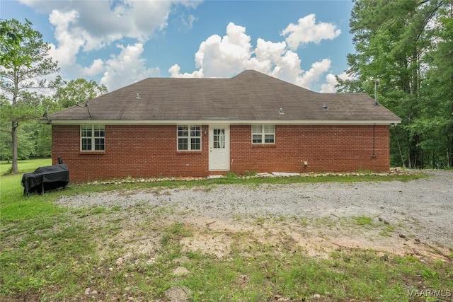 215 Hunters Rd, Eclectic, AL 36024 - rear view of house featuring brick siding and roof with shingles