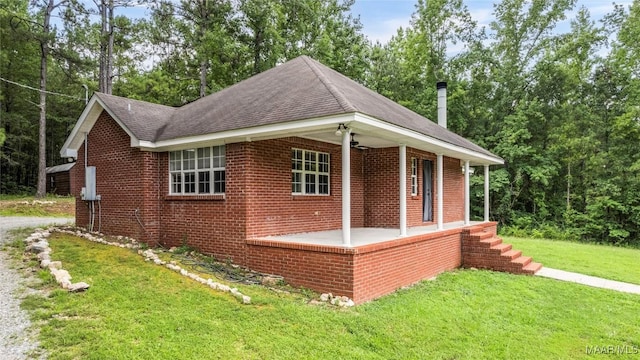 215 Hunters Rd, Eclectic, AL 36024 - view of front of home with brick siding, a front lawn, and roof with shingles