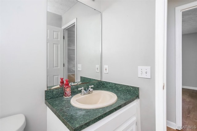 215 Hunters Rd, Eclectic, AL 36024 - bathroom with vanity and a textured ceiling