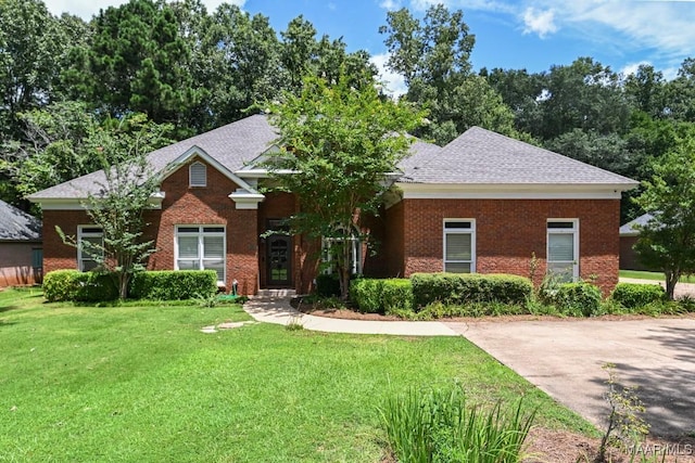7930 Mossy Oak Dr, Montgomery, AL 36117 - view of front facade with a front lawn, brick siding, and roof with shingles