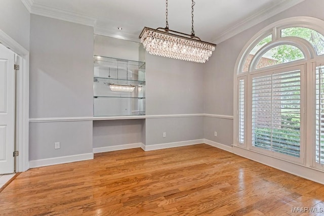 7930 Mossy Oak Dr, Montgomery, AL 36117 - empty room with crown molding, wood finished floors, and a chandelier