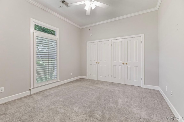 7930 Mossy Oak Dr, Montgomery, AL 36117 - unfurnished bedroom featuring crown molding, carpet, a ceiling fan, and a closet
