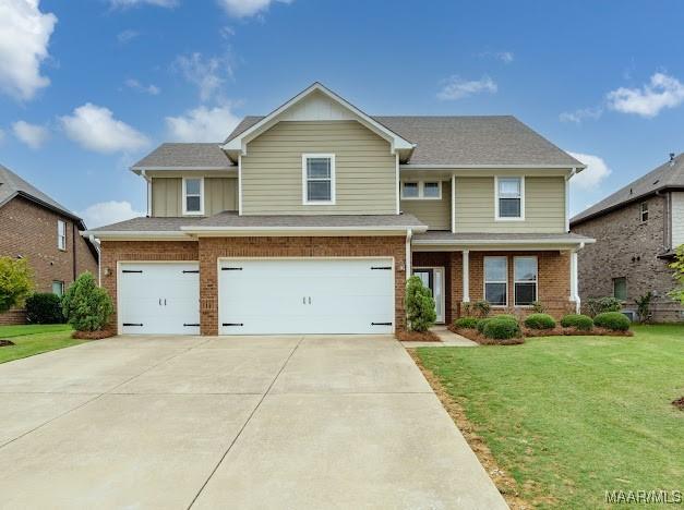1531 Wingate Park Ct, Montgomery, AL 36117 - view of front of house with a garage, brick siding, a front lawn, and concrete driveway