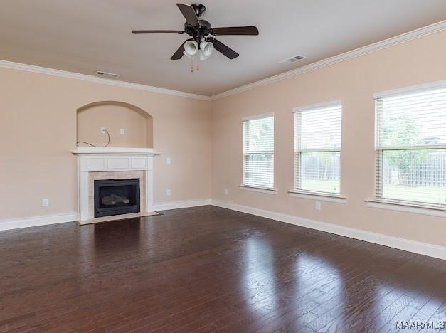 1531 Wingate Park Ct, Montgomery, AL 36117 - unfurnished living room with plenty of natural light, dark wood-style floors, a tiled fireplace, ornamental molding, and a ceiling fan