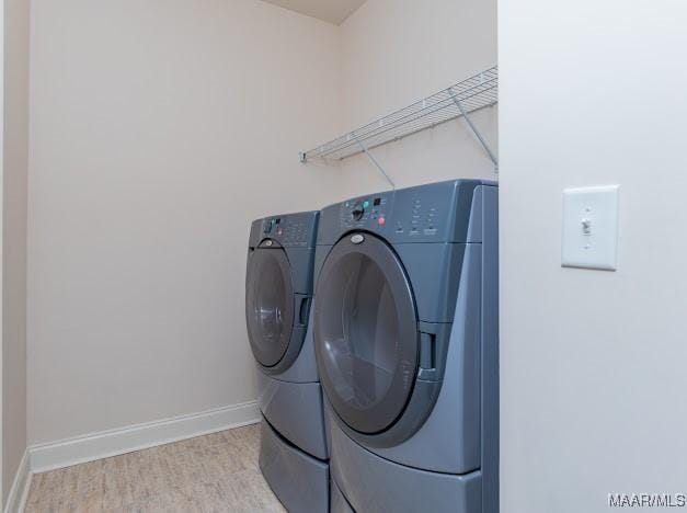 1531 Wingate Park Ct, Montgomery, AL 36117 - laundry area with washing machine and clothes dryer and wood finished floors