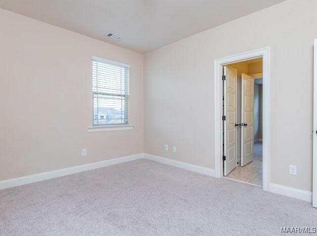 1531 Wingate Park Ct, Montgomery, AL 36117 - spare room with light carpet and baseboards