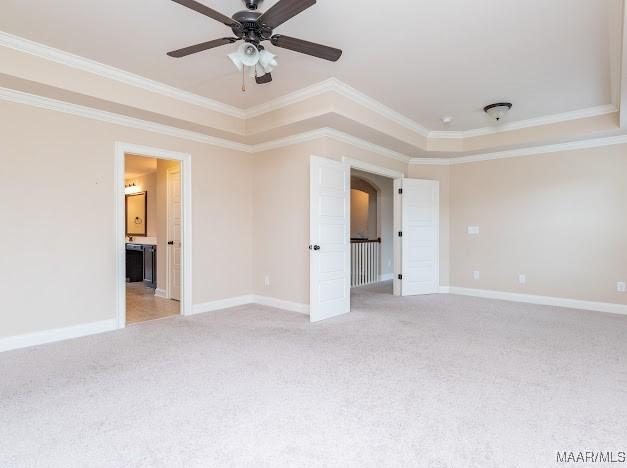 1531 Wingate Park Ct, Montgomery, AL 36117 - empty room with crown molding, light carpet, ceiling fan, and a raised ceiling